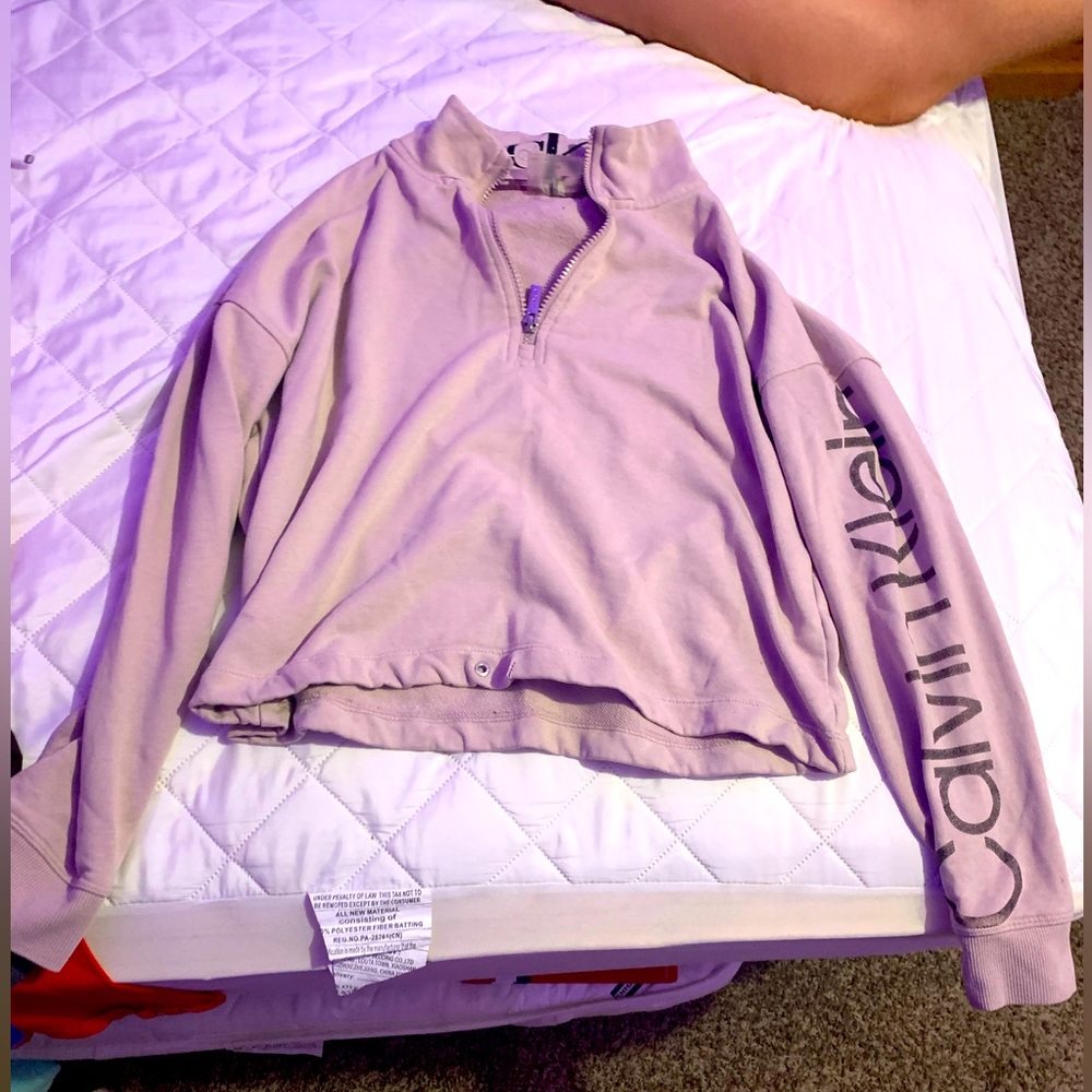 Calvin Klein, long sleeve shirt with collar and zipper.